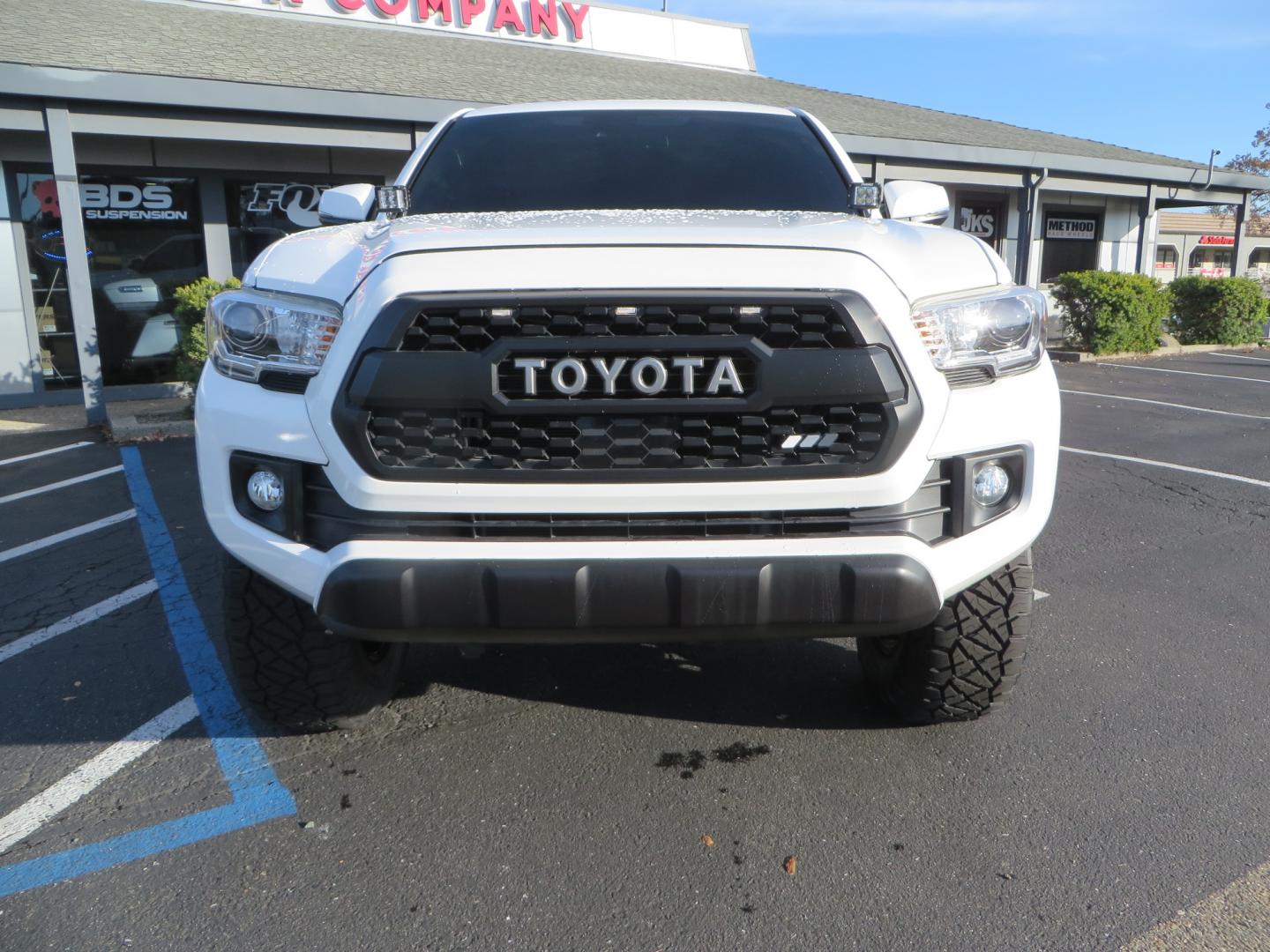 2019 White /black Toyota Tacoma TRD OFF-ROAD Double Cab (3TMAZ5CN4KM) with an 3.5L engine, automatic transmission, located at 2630 Grass Valley Highway, Auburn, CA, 95603, (530) 508-5100, 38.937893, -121.095482 - TRD Offroad 2WD sitting on Fox 2.5 remote reservoir DSC Coil-overs, Total Chaos upper control arms, Rigid Industries Dually side shooter leds, Fuel Rebel wheels, Nitto Ridge Grappler tires, and window tint. - Photo#1